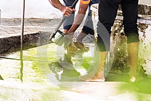 Men washing their feet making ablution on a fount in a mosque in Male,  Maldives photo