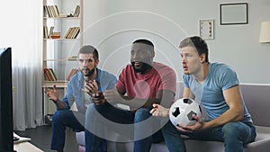 Men watching football, high expectation of goal, burst out roaring after scored
