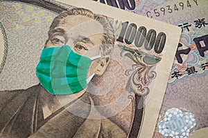 Men wear face mask on Japanese yen bill banknote background. Global novel coronavirus Covid-19 outbreak effect to Japan