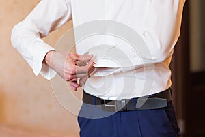 Men wear a shirt and cufflinks close-up