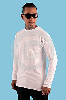 Men wearing white long sleeve t shirt isolated on background.