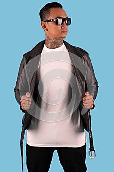Men wearing white long sleeve t shirt and leather faux jacket isolated on background.