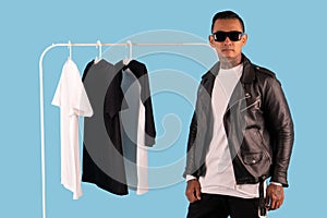 Men wearing white long sleeve t shirt and leather faux jacket isolated on background.