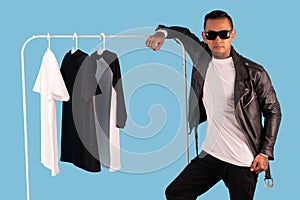 Men wearing white long sleeve t shirt and leather faux jacket isolated on background.