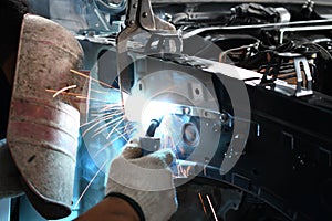 Men welder automotive part - auto body repair