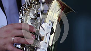 Men in a white jacket playing the saxophone