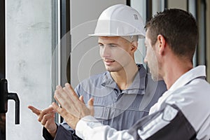 men and window installation worker