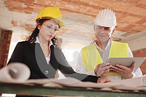 Female Architect and Foreman Meeting In Construction Site photo