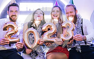 Men and women celebrating the new year 2022