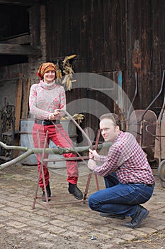 Men and women cutting branch