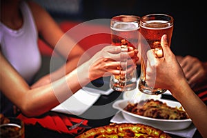 Men and women drink beer at the bar.