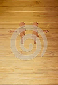 Men and Women symbol, Toilet sign. wooden wall background. illus