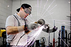 Men at work grinding steel photo