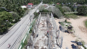 Men Working At Building Site Along The Road In Thailand. Construction Concept. aerial drone