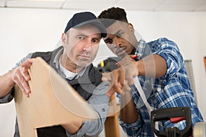 Men working in carpentry workshop