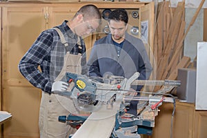Men working in carpentry workshop