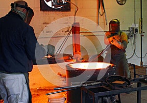 Men Working at the Foundry Hot Furnace