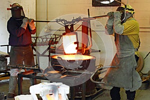 Men Working in the Foundry Hot Furnace