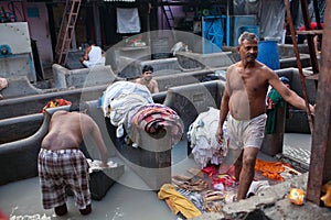 Men working hard at Dhobi Ghat in Mumbai, India