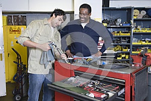 Men In Workshop With Tools