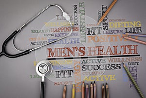 Men's health. Colored pencils and a stetoscope on the table