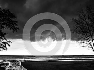 Menacing storm clouds gathering over beach