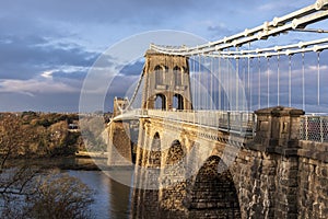 Menai Bridge in late winter sunset with cloudy skies