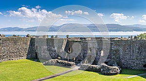 Menai Straits with low mist viewed from inside Beaumaris castle, anglesey north Wales