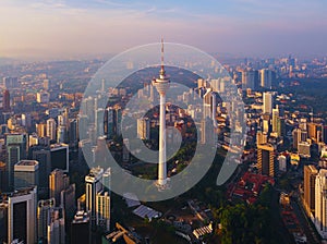 Menara Kuala Lumpur Tower with sunset sky. Aerial view of Kuala Lumpur Downtown, Malaysia. Financial district and business centers