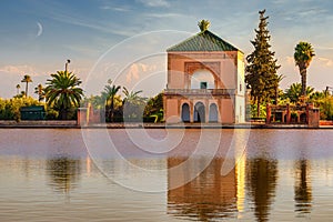Menara Pavilion reflected on lake in late afternoon sunshine in Marrakesh, Morocco