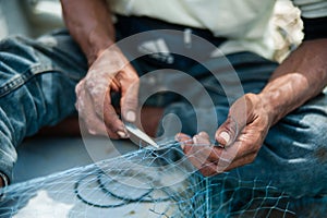 Mending fishing net photo