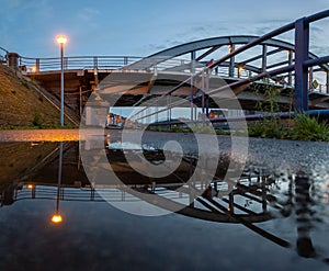 Menen bridge across the Leie with reflected on water