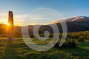 Menhir of Arlobi at sunset, Gorbea Natural Park, Alava, Spain photo