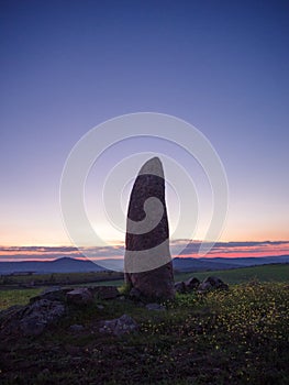 Menhir in spain at the fall of the sun