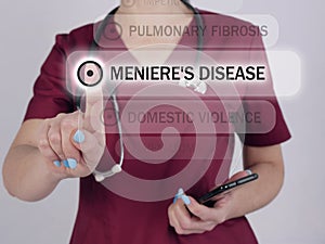 MENIERE`S DISEASE text in list. Doctor looking for something at smartphone photo