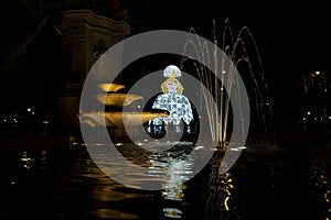 Menina. Menina de luz decorating the streets of the city of Madrid at Christmas time.