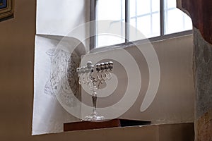 Menorah in the interior of the 17th century Kupa Synagogue in Kazimierz, the historic Jewish quarter of Krakow, Poland