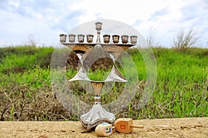 Menorah and wooden Dreidels of Jewish holiday Hanukkah