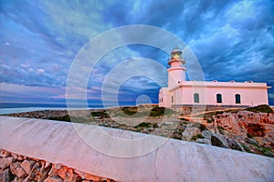 Menorca sunset at Faro de Caballeria Lighthouse photo
