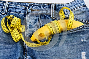 Mens denim pants with banana imitating male genitals, close up