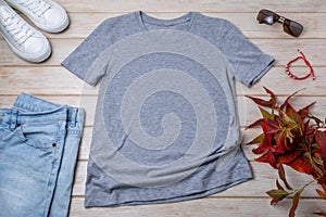 Mens gray T-shirt mockup with wild grass and bracelet