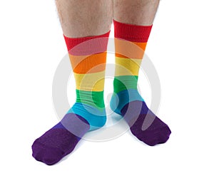 Mens hairy legs in colored striped socks fun. Isolate