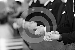 Mens hands in a church