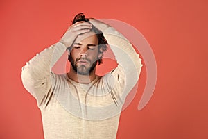 Mens heals body care. Sleepy man with beard on red background.