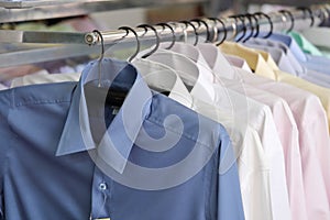 Mens plaid shirts on hangers in a retail store