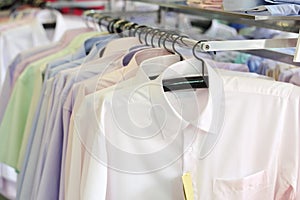 Mens plaid shirts on hangers in a retail store