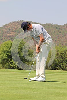 Mens pro golfer Jean van de Velde putting for a birdie on November 2015 in South Africa