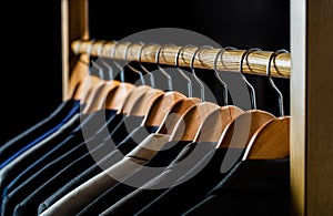 Mens shirts, suit hanging on rack. Hangers with jackets on them in boutique. Suits for men hanging on the rack. Mens