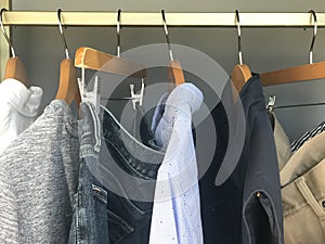 Mens stylish clothing on hangers