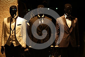 Mens suits on shop mannequins.